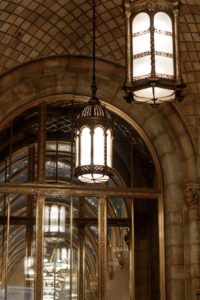 Close-up shot of light fixtures hanging from an arched ceiling
